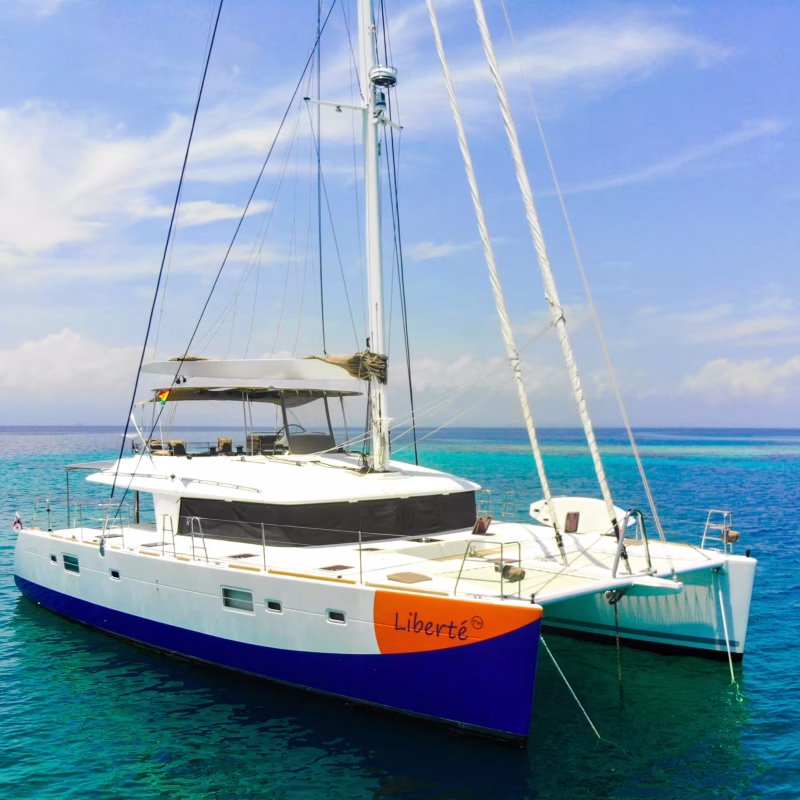 Lagoon 56 catamaran anchored in calm turquoise waters with clear skies in San Blas, Panama