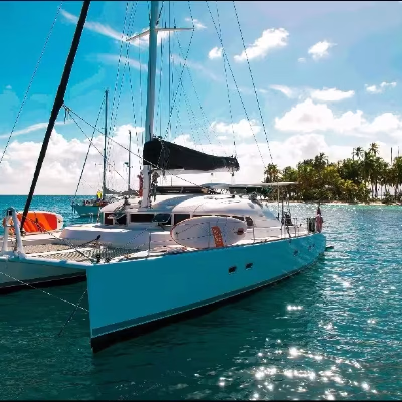 Lagoon 47 catamaran anchored in turquoise waters under a sunny sky in San Blas, Panama