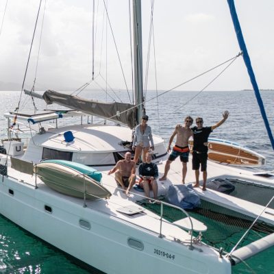 Venezia 42 catamaran with guests sunbathing and preparing for sailing in San Blas, Panama